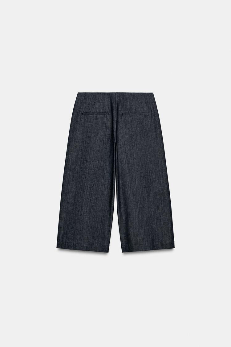 a COLETTE LONG BUTTON SHORTS