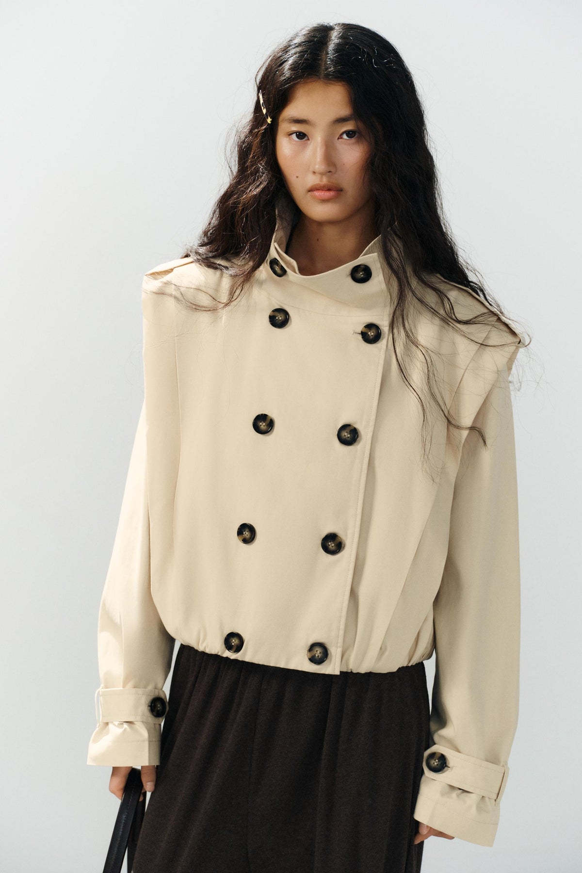 a SHARON SHORT PLEATED TRENCH COAT