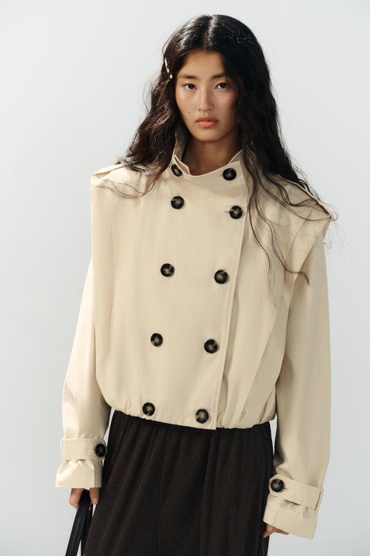 a SHARON SHORT PLEATED TRENCH COAT
